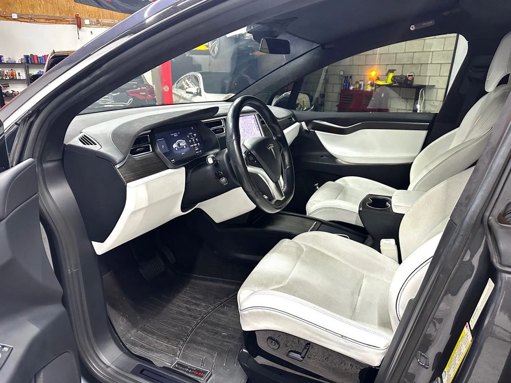 Tesla Model X cockpit with white interior